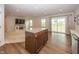Open-concept living room featuring a fireplace and sliding glass doors at 1863 River Birch Dr, Greenfield, IN 46140