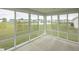 Bright sunroom with large windows showcasing scenic outdoor views at 1863 River Birch Dr, Greenfield, IN 46140
