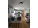 Bright kitchen featuring white cabinets, stainless steel appliances, granite countertops and wooden floors at 2248 Salem Park Dr, Indianapolis, IN 46239