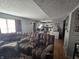 Spacious living room open to the kitchen, featuring wood floors and comfortable seating at 2248 Salem Park Dr, Indianapolis, IN 46239