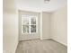 Bright bedroom with neutral carpet and window bringing in natural light at 2306 Brightwell Pl, Indianapolis, IN 46260