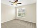 Bright bedroom with neutral carpet and window bringing in natural light at 2306 Brightwell Pl, Indianapolis, IN 46260
