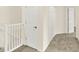 Upstairs hallway with access to multiple closets and bedrooms in neutral colors at 2306 Brightwell Pl, Indianapolis, IN 46260