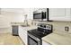 Well-equipped kitchen boasts white cabinets and stainless steel appliances at 2306 Brightwell Pl, Indianapolis, IN 46260