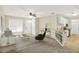 Open-concept living area featuring neutral decor and seamlessly blending the kitchen and living spaces at 2306 Brightwell Pl, Indianapolis, IN 46260