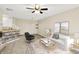 Bright living room with ceiling fan, neutral walls, open space, and stylish decor at 2306 Brightwell Pl, Indianapolis, IN 46260