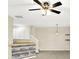 Bright living room with ceiling fan, neutral walls, open space, and stylish decor at 2306 Brightwell Pl, Indianapolis, IN 46260
