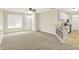 Open-concept living area featuring neutral decor and seamlessly blending the kitchen and living spaces at 2306 Brightwell Pl, Indianapolis, IN 46260