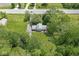 Beautiful aerial view of the property, featuring a well-manicured yard with mature trees and a charming home at 2346 N State Road 39, Danville, IN 46122