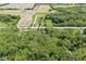A stunning aerial view showing the expansive property, surrounding farmlands, and lush greenery of the neighborhood at 2346 N State Road 39, Danville, IN 46122
