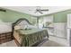 Bedroom with a king size bed and light-green-painted walls and white trim at 2346 N State Road 39, Danville, IN 46122