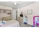 Charming bedroom with pink walls, a dresser, and a walk-in closet at 2346 N State Road 39, Danville, IN 46122