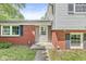 Home with brick facade and gray siding and a concrete walkway leading to the front door at 2346 N State Road 39, Danville, IN 46122