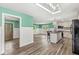 Bright eat-in kitchen features a center island, natural light from the skylight, and stylish appliances at 2346 N State Road 39, Danville, IN 46122