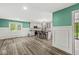 Open concept kitchen showcasing center island with bar stool seating and an adjacent dining area at 2346 N State Road 39, Danville, IN 46122