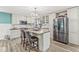 Bright kitchen features stainless steel appliances, center island with seating, and custom cabinetry at 2346 N State Road 39, Danville, IN 46122