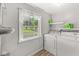Convenient laundry room with modern washer and dryer, and a view outside at 2346 N State Road 39, Danville, IN 46122