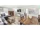 Cozy living room features wood paneling, hardwood floors, a fireplace, and a comfortable seating area at 2346 N State Road 39, Danville, IN 46122