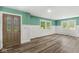 Inviting living room with hardwood floors, ample natural light, and an elegant front door at 2346 N State Road 39, Danville, IN 46122