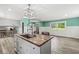 Open living area features a center island, hardwood floors, and plenty of natural light at 2346 N State Road 39, Danville, IN 46122