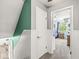 Upstairs hallway leads to a bedroom with lots of natural light at 2346 N State Road 39, Danville, IN 46122