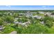 Scenic aerial view of a neighborhood featuring mature trees and well-kept lawns at 2414 N Blaine St, Muncie, IN 47303