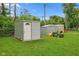 Backyard with sheds and yard equipment, providing ample storage space for outdoor essentials at 2414 N Blaine St, Muncie, IN 47303