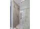 New shower featuring a glass door and gray stone tiling at 2414 N Blaine St, Muncie, IN 47303