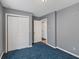 Bedroom featuring a spacious closet and neutral gray walls, offering a calming and organized space at 2414 N Blaine St, Muncie, IN 47303
