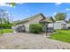 Charming home featuring a fenced yard, inviting entryway, and gravel driveway at 2414 N Blaine St, Muncie, IN 47303