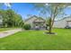 Inviting home with a well-manicured lawn and charming front porch at 2414 N Blaine St, Muncie, IN 47303