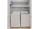Bright laundry closet featuring new washer, dryer, and shelving at 2414 N Blaine St, Muncie, IN 47303