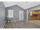 A living room featuring a front door, kitchen access and natural light at 2414 N Blaine St, Muncie, IN 47303