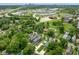 Aerial view of home and neighborhood with highway and cityscape beyond at 2417 N Rural N Ave, Indianapolis, IN 46218