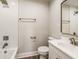 Bright bathroom with white-tiled shower, neutral walls, and a modern vanity mirror at 2417 N Rural N Ave, Indianapolis, IN 46218