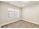 Bedroom with carpet, two windows providing natural light, and baseboard trim at 2417 N Rural N Ave, Indianapolis, IN 46218