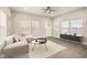 Bright living room featuring a modern sofa, coffee table, and a media console at 2417 N Rural N Ave, Indianapolis, IN 46218