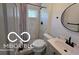 Updated bathroom featuring modern fixtures and a tile shower at 2421 N Arsenal Ave, Indianapolis, IN 46218