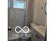 Modern bathroom featuring marble tile and stylish fixtures at 2421 N Arsenal Ave, Indianapolis, IN 46218