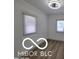 Cozy bedroom featuring natural light and newly installed hardwood floors at 2421 N Arsenal Ave, Indianapolis, IN 46218