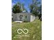 Charming home exterior with a freshly painted facade, a secure front door, and manicured landscaping at 2421 N Arsenal Ave, Indianapolis, IN 46218