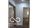 A hallway with wood floors leads to bright rooms with fresh paint and natural light at 2421 N Arsenal Ave, Indianapolis, IN 46218