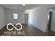 Bright living room featuring new hardwood floors and freshly painted walls at 2421 N Arsenal Ave, Indianapolis, IN 46218