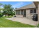 The backyard includes the screened in porch, a patio, and well-maintained lawn at 2422 Oak Dr, Clayton, IN 46118