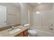 Bright bathroom featuring a vanity with granite countertop and a tub with shower at 2422 Oak Dr, Clayton, IN 46118