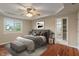 Nicely staged bedroom with tray ceiling, ceiling fan, and adjacent bathroom with stand up shower at 2422 Oak Dr, Clayton, IN 46118