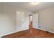 Bedroom with hardwood floors and a doorway leading to the bathroom at 2422 Oak Dr, Clayton, IN 46118