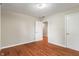 Bedroom with hardwood floors and an open doorway to another room at 2422 Oak Dr, Clayton, IN 46118