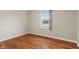 Bedroom with hardwood floors and a large window at 2422 Oak Dr, Clayton, IN 46118