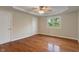 Bright bedroom featuring wood floors, neutral walls, and a sunny window at 2422 Oak Dr, Clayton, IN 46118